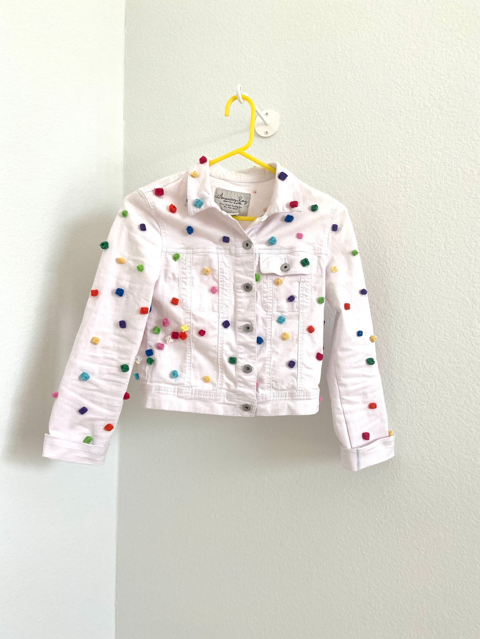 Confetti jean jacket - handmade pompoms from Jumbo Jibbles, artist Amy Brown