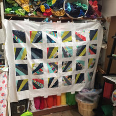 Finished quilt top - all squares are hand sewn!