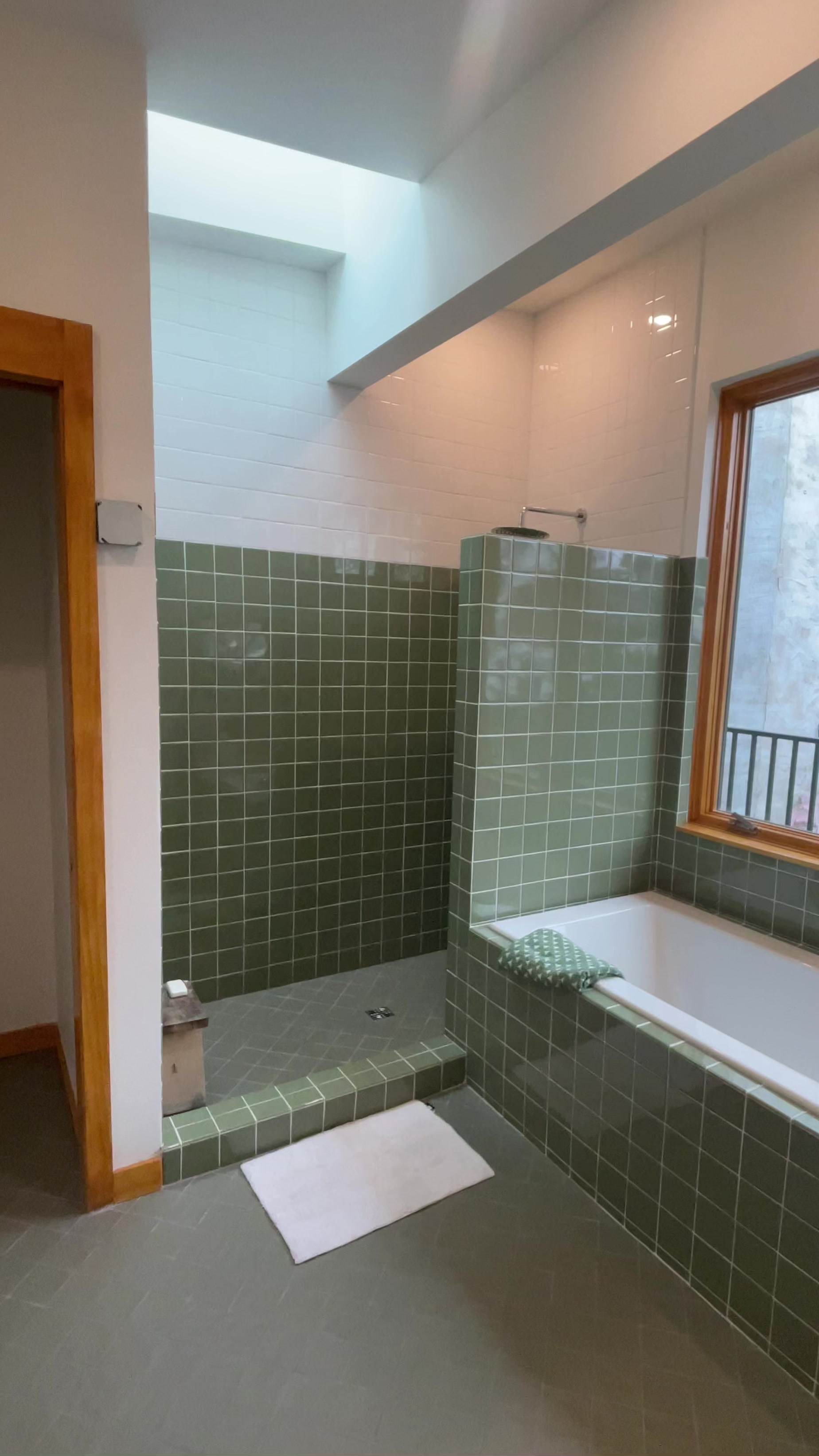 Green tiled bathroom after the renovation