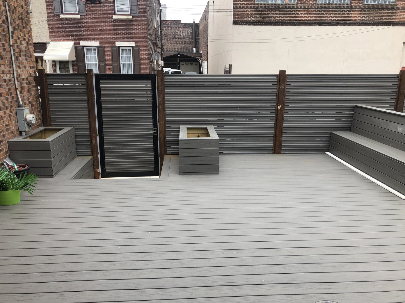 Concrete roof deck and rear patio work in Port Richmond