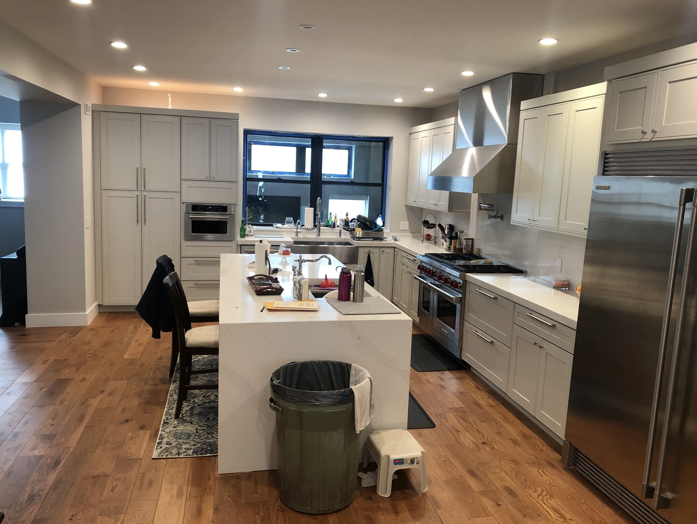 Kitchen island with seating and stainless appliances