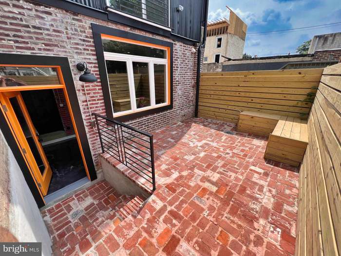 Rear yard with brick patio after the rehab