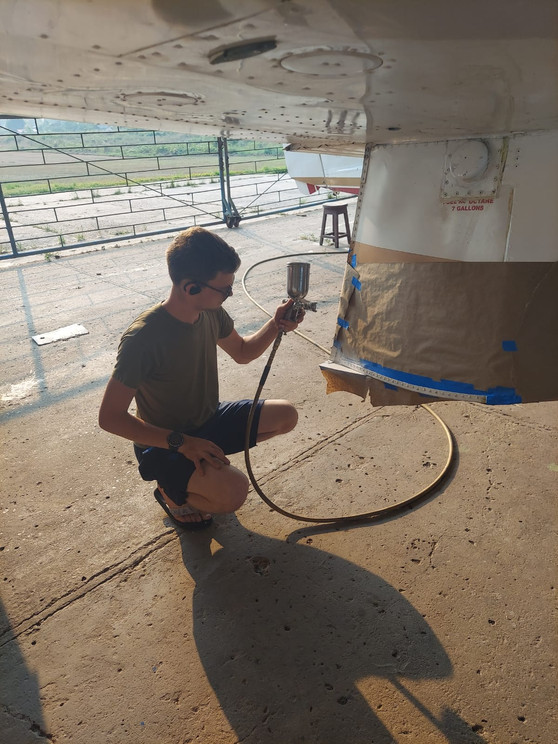 Acker helping paint the Lake Amphibian