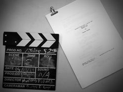Clapperboard and script