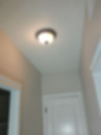 Modern flush mount ceiling light in an entryway