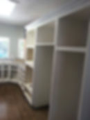 White custom kitchen cabinetry installation in progress.
