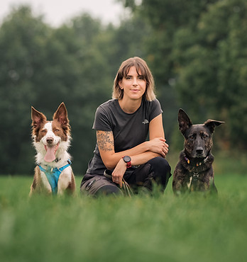 Leamington Spa dog behaviourist with her two dogs, all looking at the camera