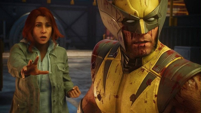 Mulher ruiva estende a mão para Wolverine ensanguentado em traje amarelo, num cenário industrial escuro e tenso.