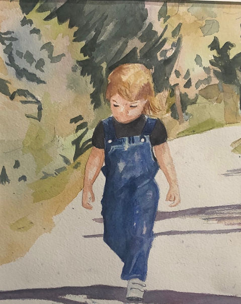 Toddler girl walks on the sidewalk.