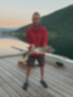 RM holding a Sea Trout caught from the pier at home