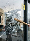 Security window film helping retain broken glass after impact