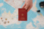 Do I need a residence permit to work and live in Germany ? Image represents a person holding a German passport