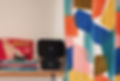 Close up shot of a wifi router surrounded by vibrant abstract curtains