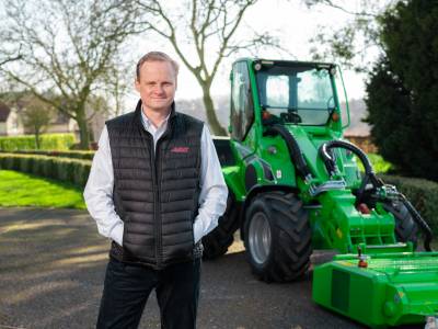 Man standing in front of heavy equipment