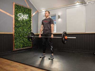 Man deadlifting in gym 