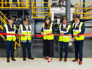 Offgrid Energy Labs team cutting a red ribbon at their industrial facility opening ceremony