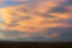 A sunset sky over a roadless public land landscape