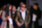 Young actors in a media production scene on stage