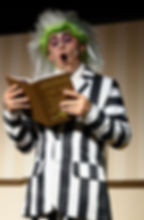 Beetlejuice media actor reading the handbook for the deceased