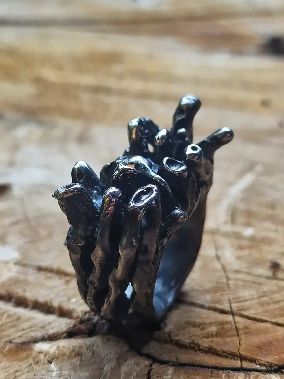 a close up of a ring on a wooden surface
