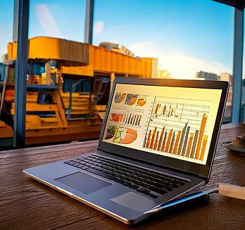 Firefly data analysis reports and laptop on wood desk with computer, business concept, sel