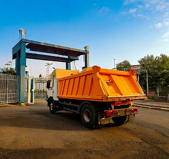 Firefly indian dumper truck exiting the securtiy gate of industry 4660.jpg