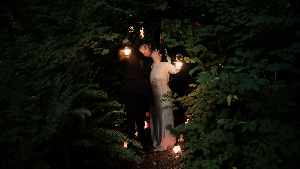 Couple embraces and kisses after their Wellspring Spa micro wedding near Mt Rainier. It is night time, and the couple is holding lanterns to illuminate the scene.