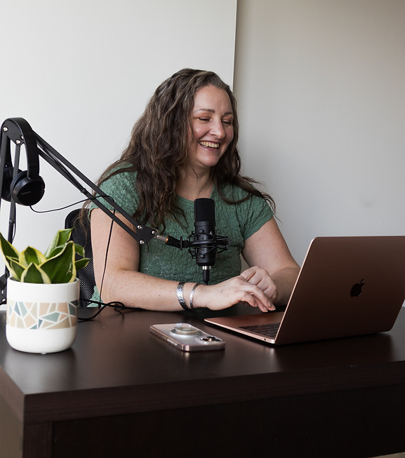 Woman recording a podcast at Sulis Collective