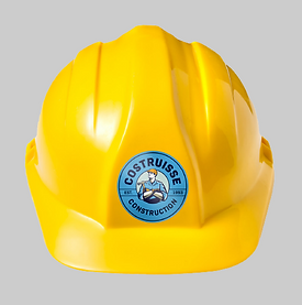 Small, blue, circular decal on the front of a bright yellow hard hat.
