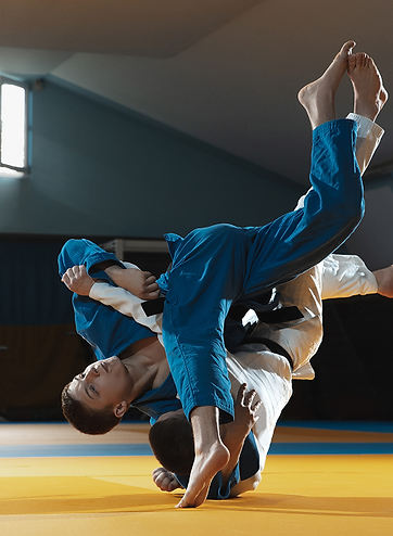 two-young-fighters-kimono-training-martial-arts-gym.png