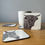 Thumbnail: Coasters featuring realistic  graphite pencil artwork by Catrin Membery, donkey and highland cow set