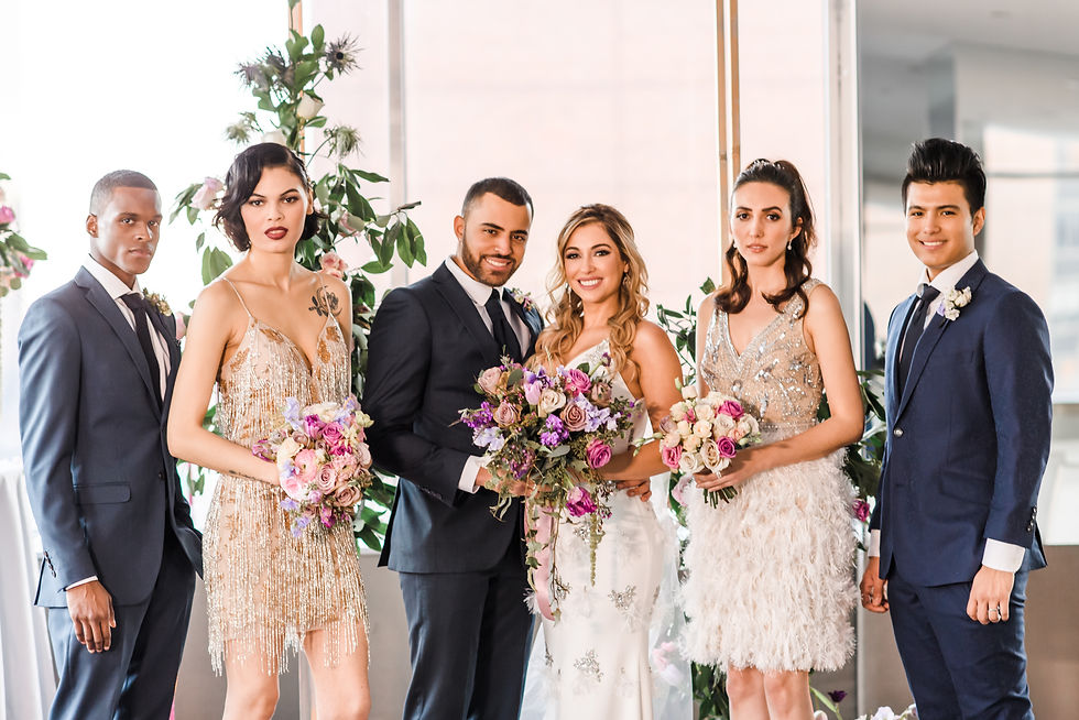 Diverse wedding party in NYC styled shoot featuring colorful florals, metallic dresses, and modern formalwear, blending fun fashion with elegant wedding style.