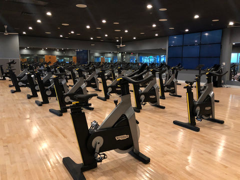 Indoor cycling studio filled with bikes