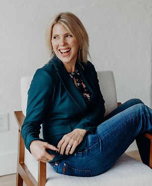 Britt Bilgrien, NP, smiling while seated in a chair — founder of Bilgrien Health and holistic wellness provider.
