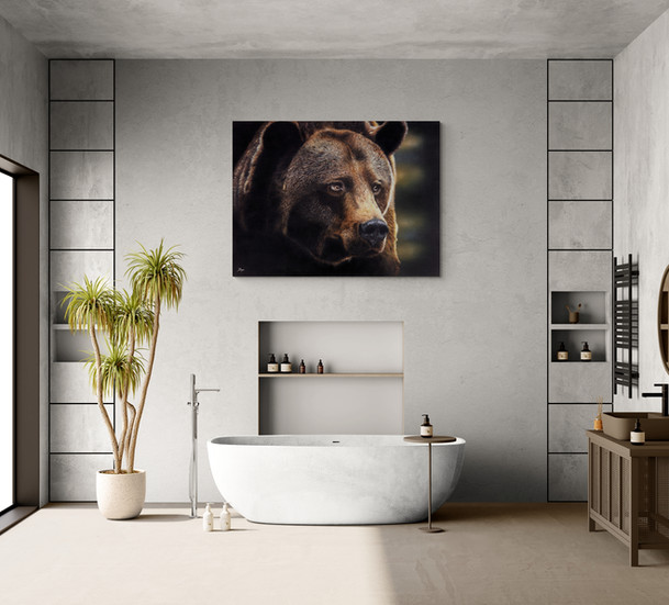 “‘Out of Darkness,’ bear canvas displayed in a modern bathroom above a freestanding soaker tub with tropical plant decor.