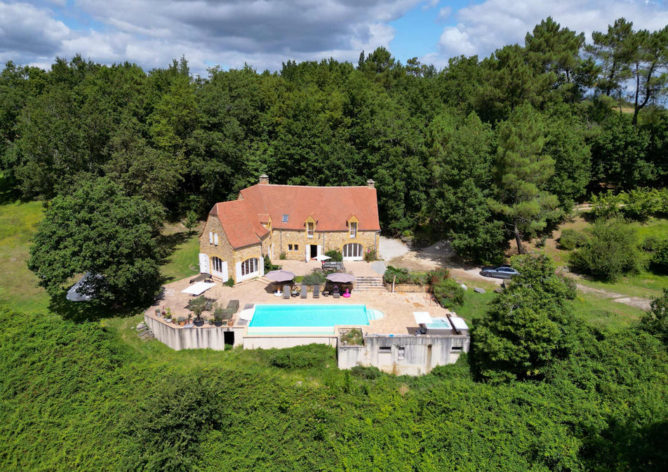 Traditional old stone house in the French countryside surrounded by nature, used as a retreat location.