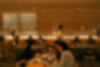 Guests dining in the white oak room at Prime Seafood Palace