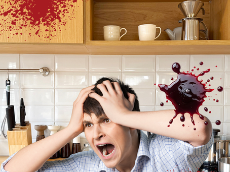 a man covered in blood in the kitchen