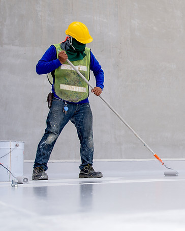 Construction worker coating floor by epoxy .jpg