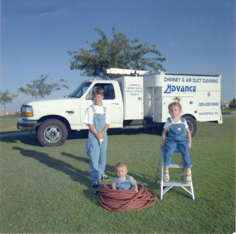 Three of our children in front of our new Air duct cleaning truck in 1997