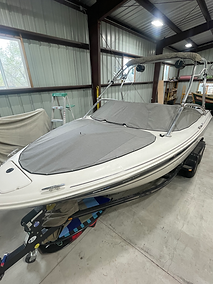 Picture of white boat with custom travel cover