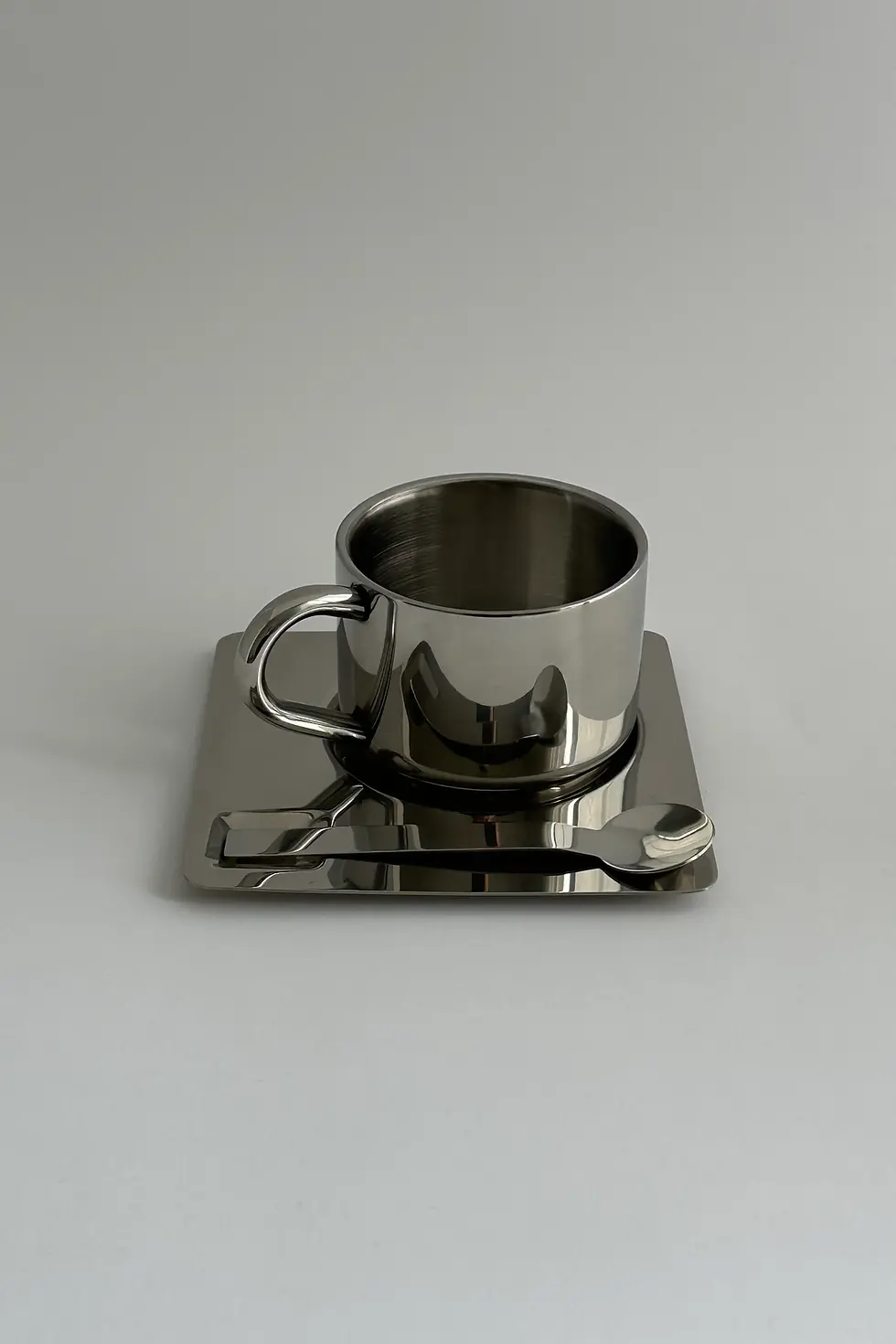 Double-walled stainless steel coffee cup with mirror finish for espresso and tea