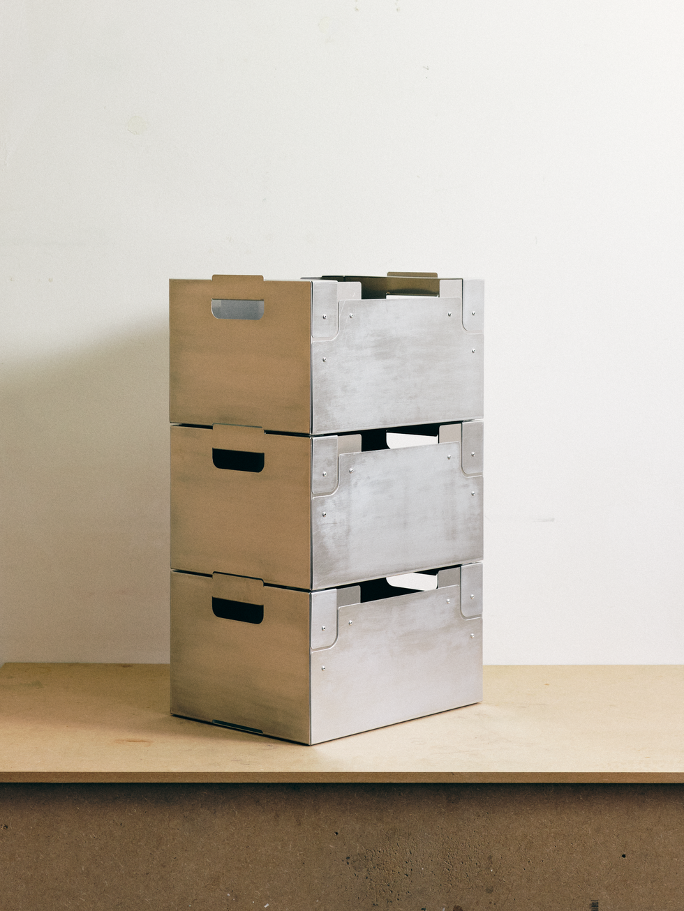 Three stackable BOTHI Metal Crates in raw aluminium, shown vertically in a minimalist studio setting.