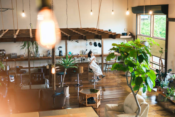 A modern restaurant featuring a wooden table and chairs, showcasing a cozy dining area.