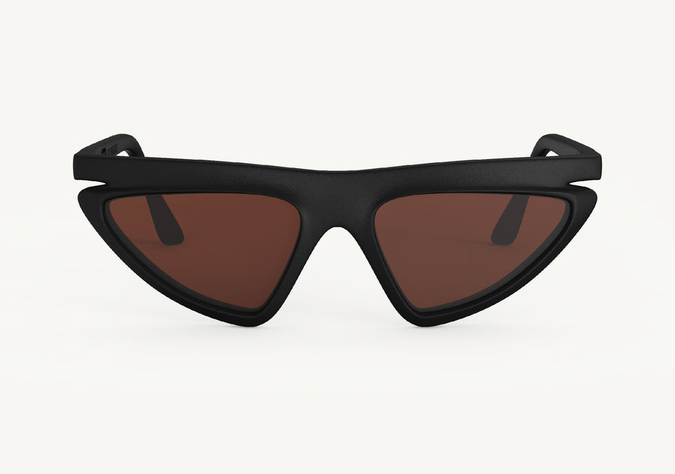 Pixie Cut sunglasses with a black angular cat‑eye frame and brown lenses, front view on a white background.