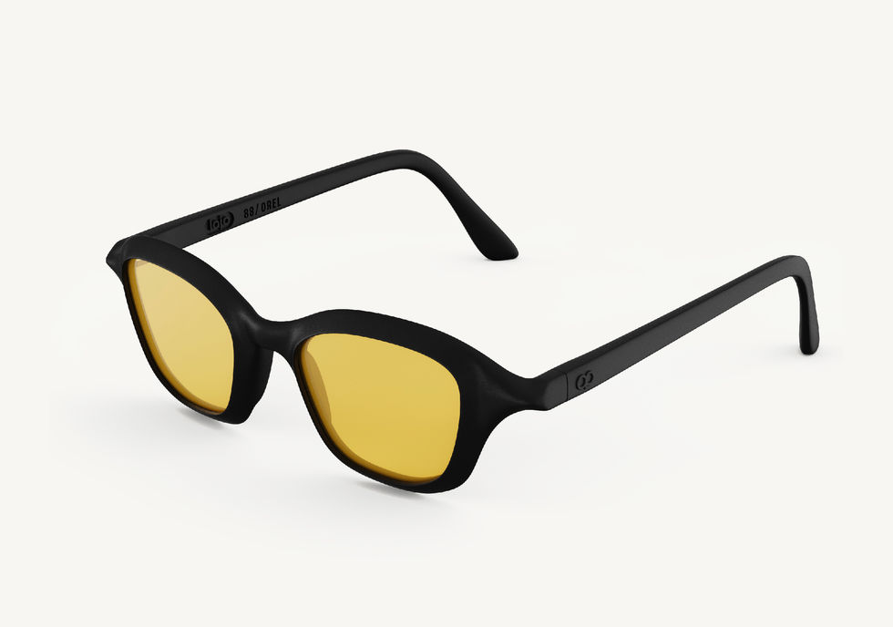 Orel sunglasses with a black square frame and yellow lenses, angled side view showing the temples.