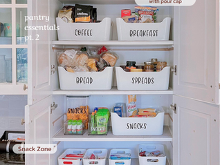 Organized pantry with labeled bins for cereal, coffee, breakfast, bread, spreads, snacks, bars, and sauce on white shelves.