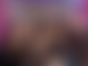 Smiling group of eleven women in black "Sparkling Homes Cleaning Service" hoodies with pink text, standing before a shiny mosaic backdrop.