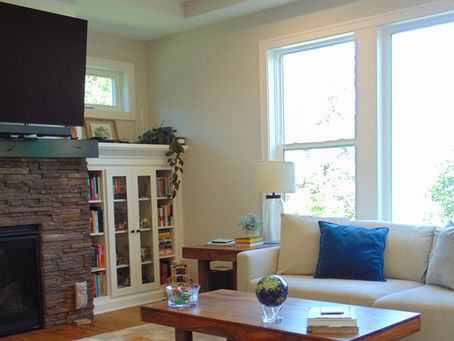 Clean living room with light shining through the window