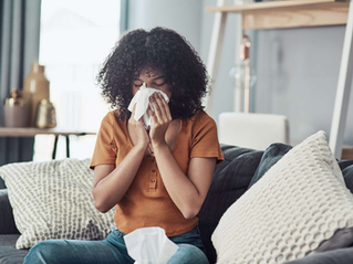 a high-quality photo at the very top of your post showing someone dealing with allergies in a living room setting.